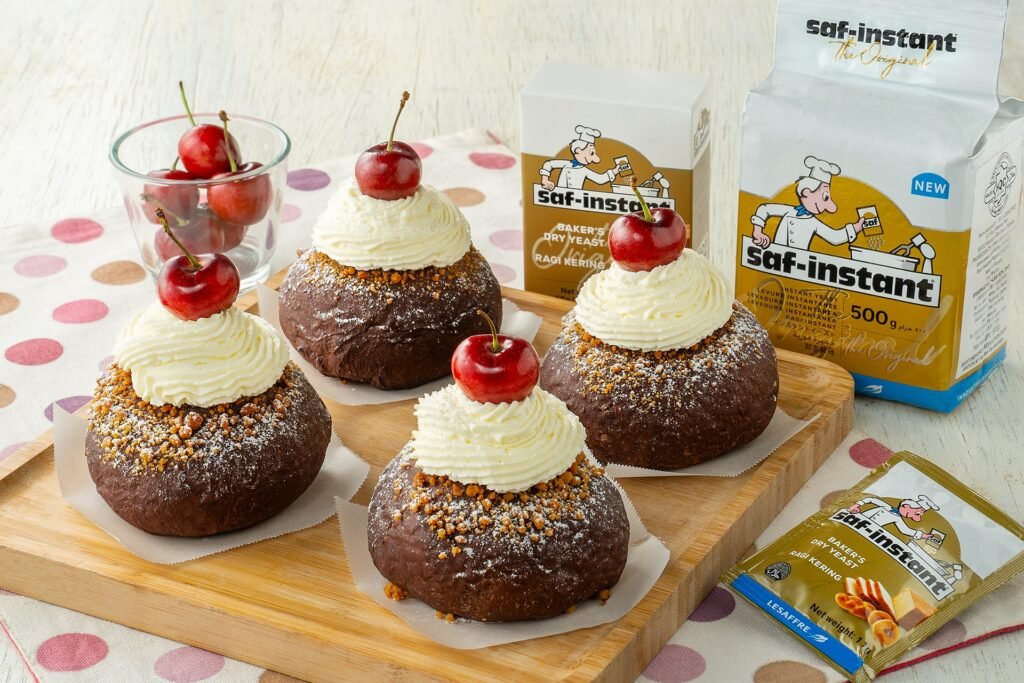 Black forest bread topped with cream and cherries, styled with Saf-instant yeast
