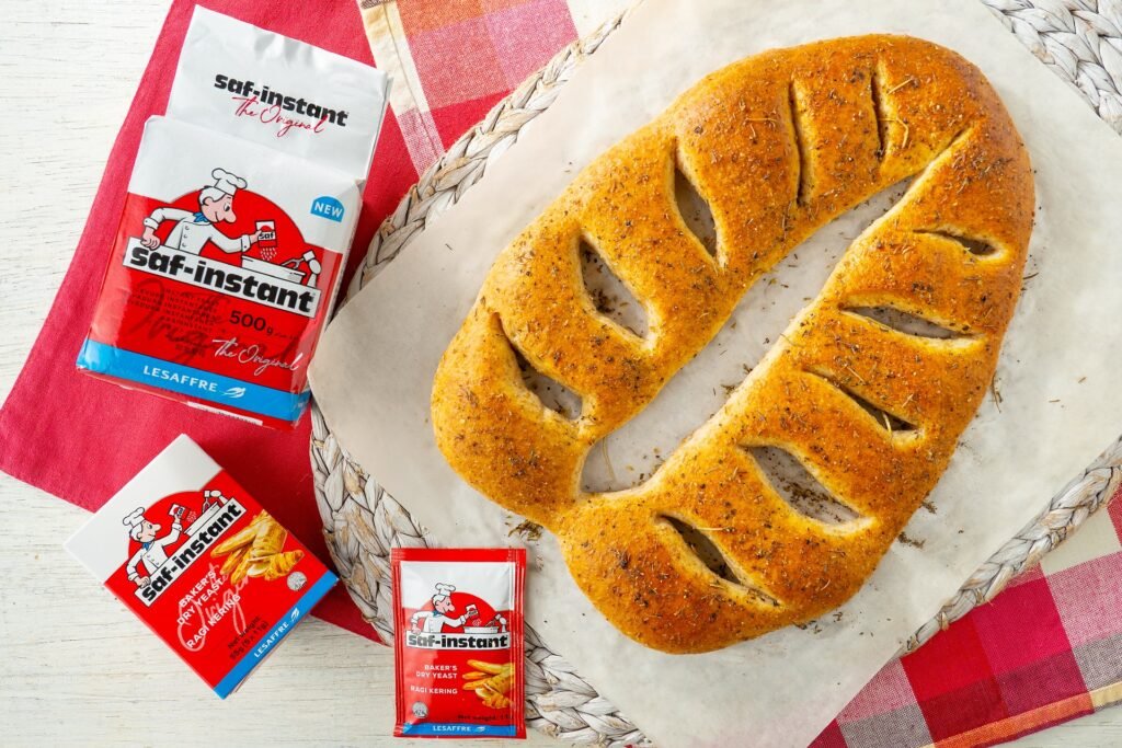 Mixed herbs fougasse on a woven mat with Saf-instant yeast packs