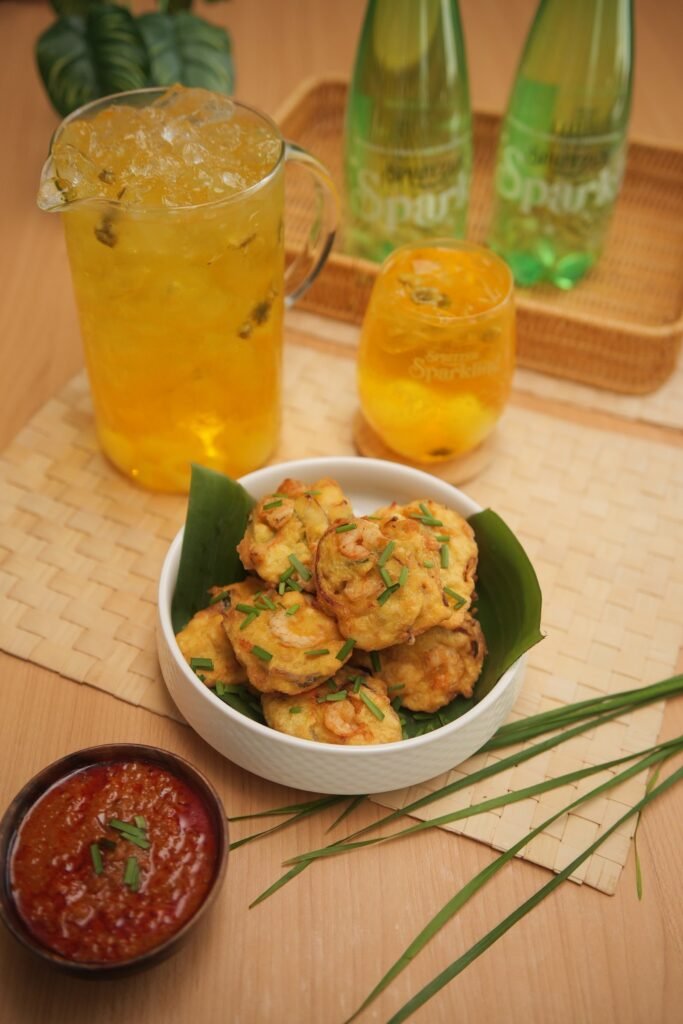 Cucur Udang Crispy Sparkling with a jug of Teh Bunga Longan Sparkling and Spritzer Sparkling bottles